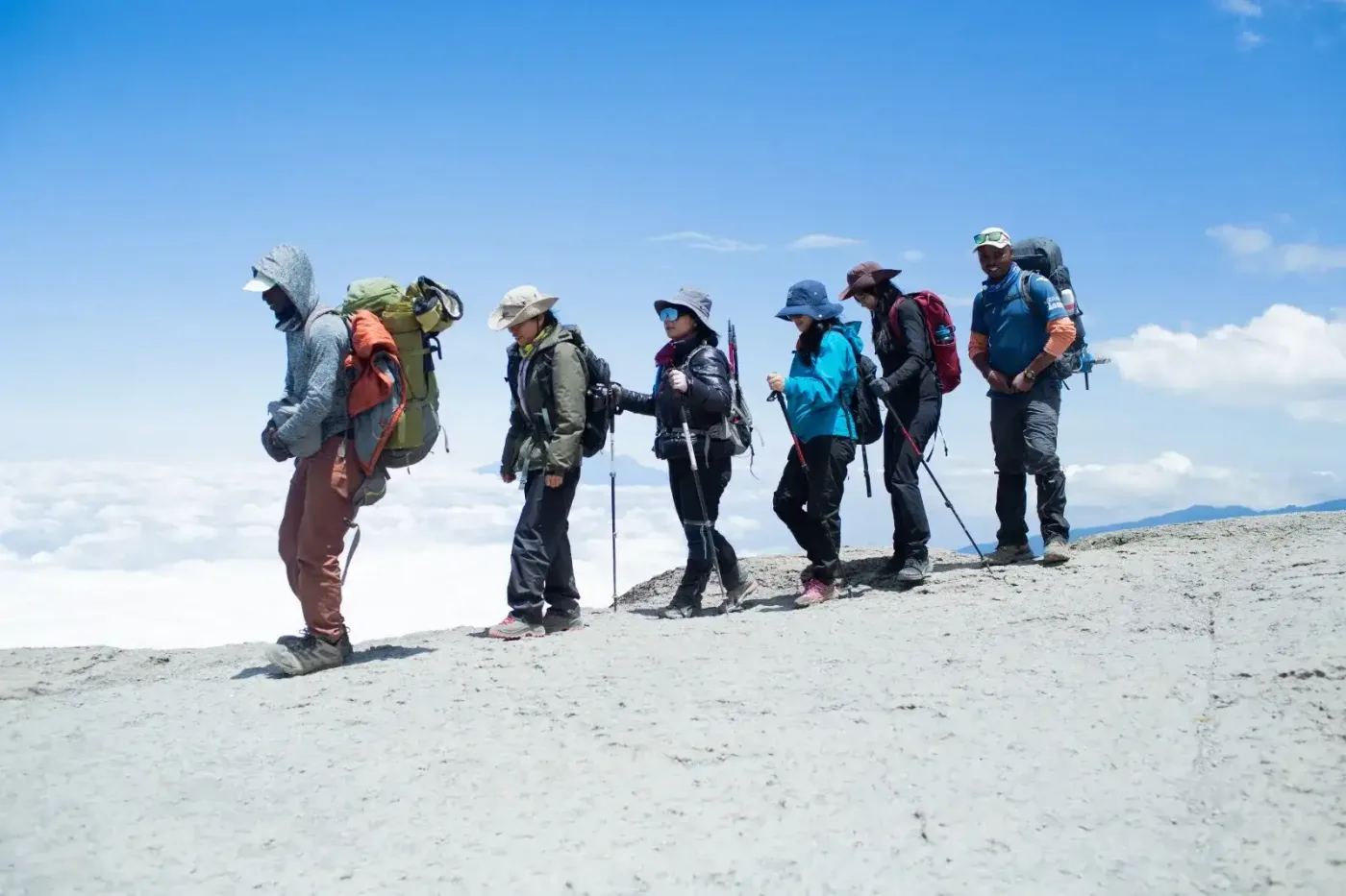 Trekkers on a scenic Kilimanjaro route with Mount Kilimanjaro in the background