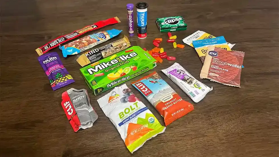 Trekker eating energy snacks on Mount Kilimanjaro