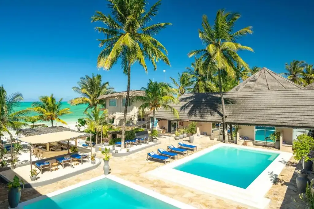 Paje Beach with kitesurfers gliding over turquoise waters and white sandy shores