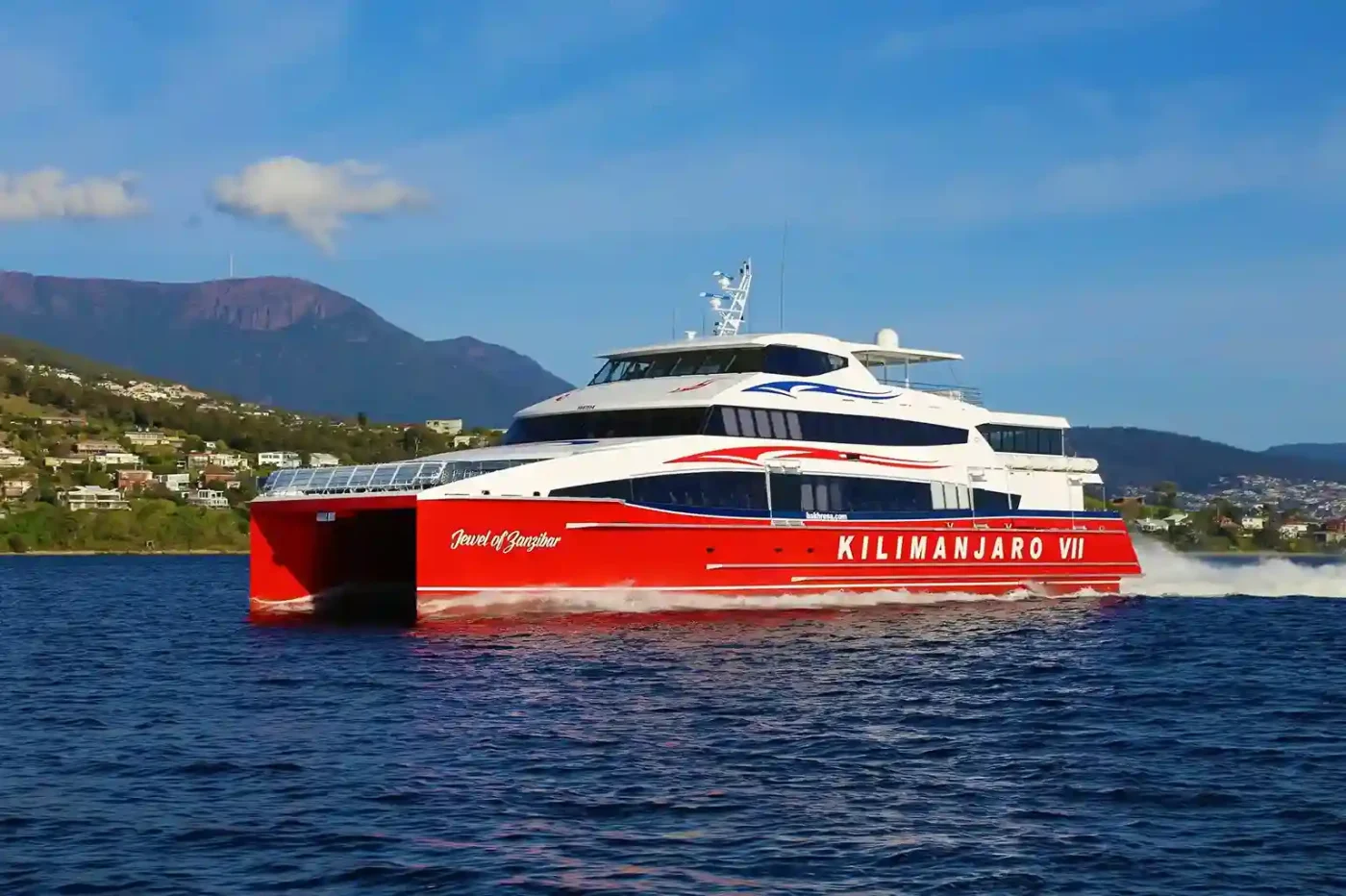 Ferry crossing between Zanzibar and mainland Tanzania, showcasing travelers on board